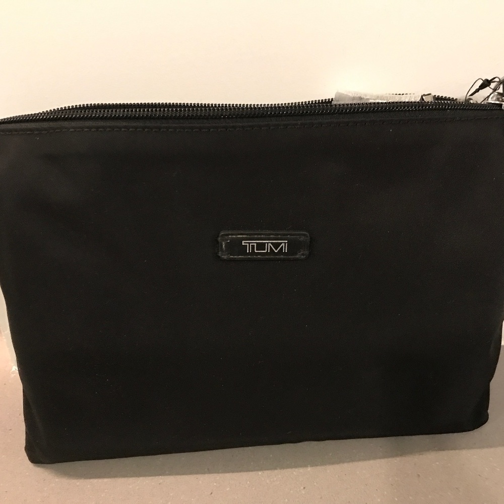 Tumi - brand new never used, travel duffel, black